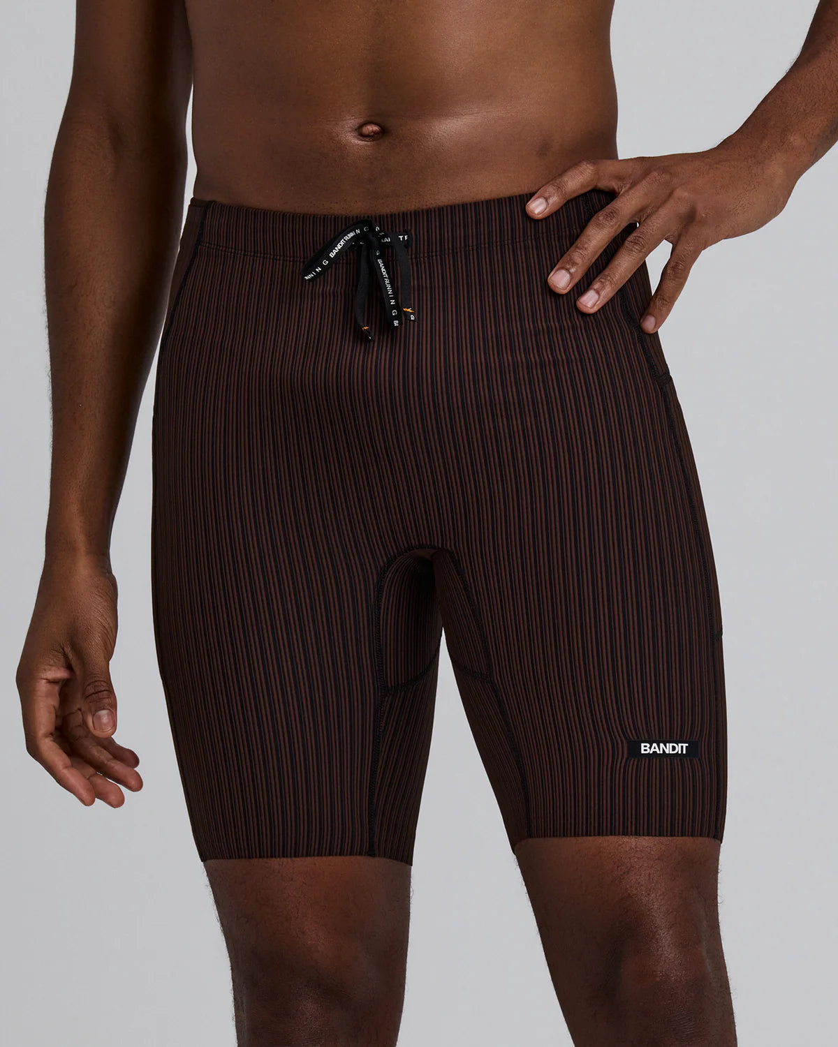 Bandit Running Men's Striped Cadence™ 7 Pocket Lined Half Tights - Cacao / Black