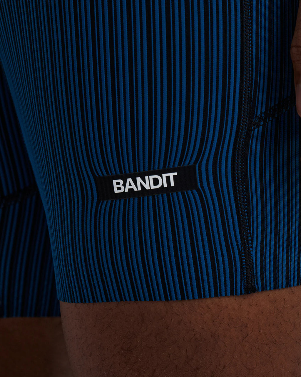 Bandit Running Men's Striped Cadence™ 7 Pocket Lined Quarter Tights - Ink Blue / Black