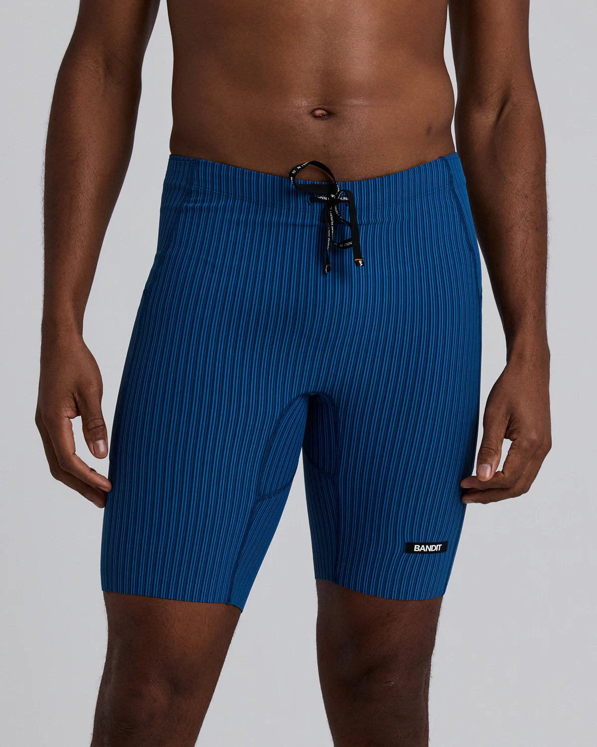 Bandit Running Men's Striped Cadence™ 7 Pocket Lined Half Tights - Ink Blue / Aegean