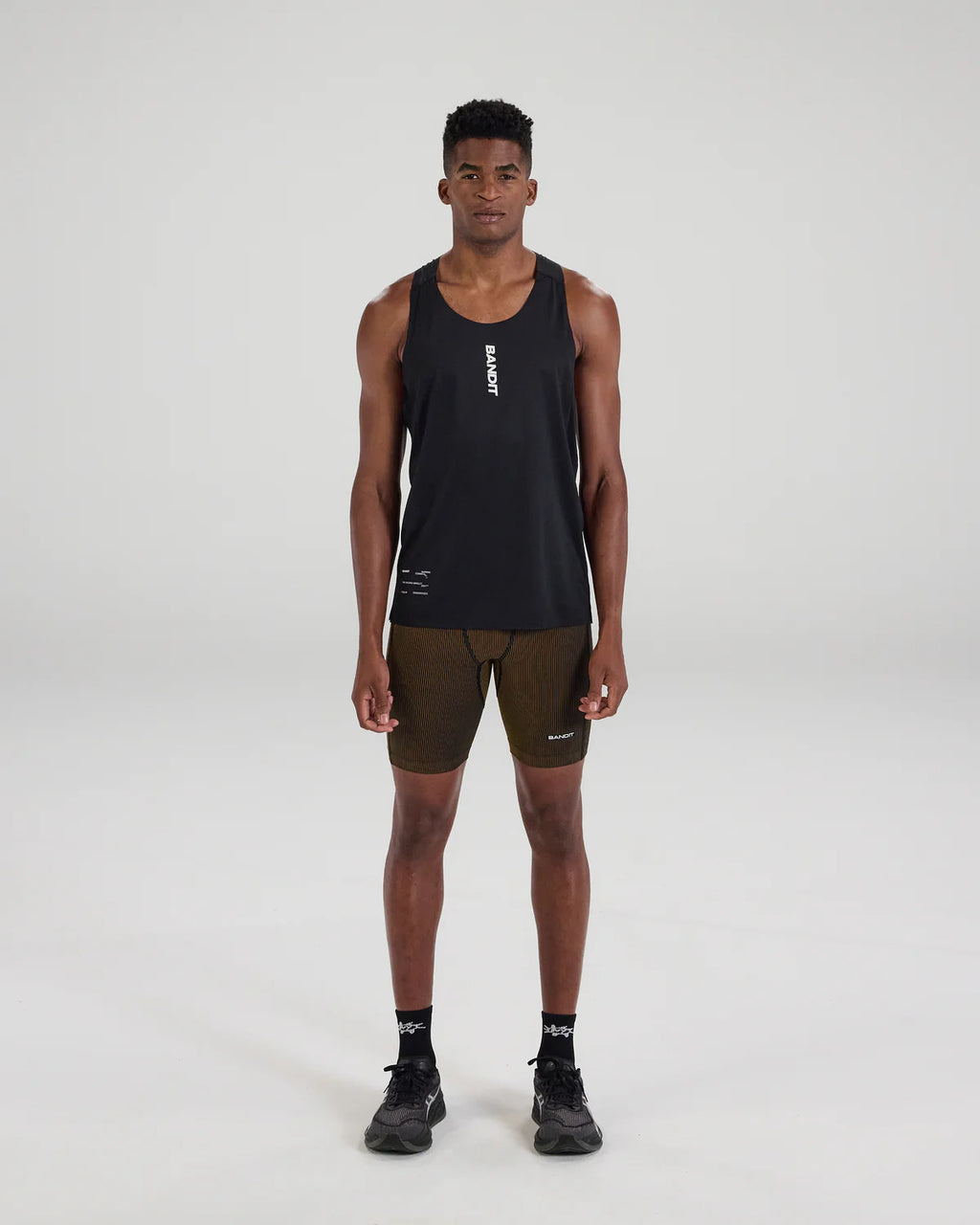 Bandit Running Striped Cadence™ 7 Pocket Half Tights - Black / Dijon