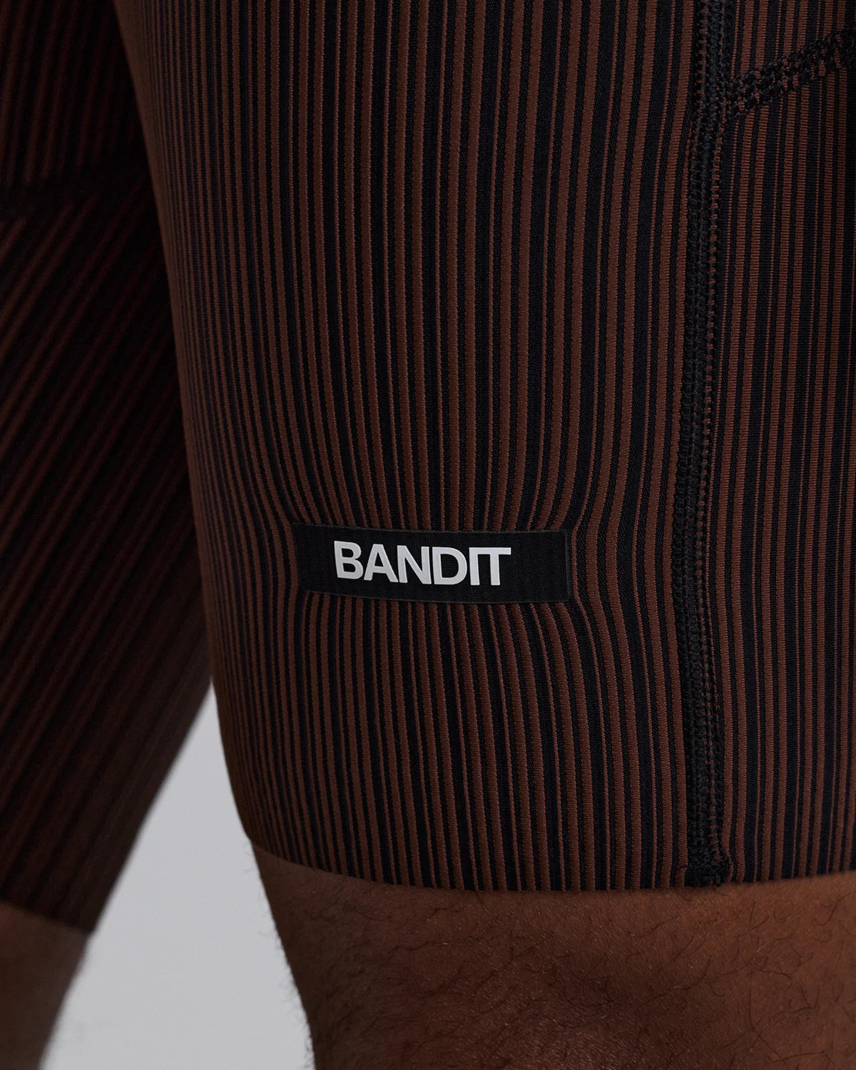Bandit Running Men's Striped Cadence™ 7 Pocket Lined Half Tights - Cacao / Black