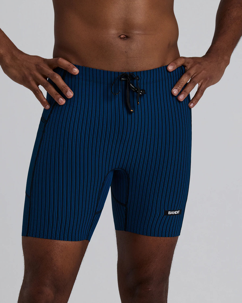 Bandit Running Men's Striped Cadence™ 7 Pocket Lined Quarter Tights - Ink Blue / Black