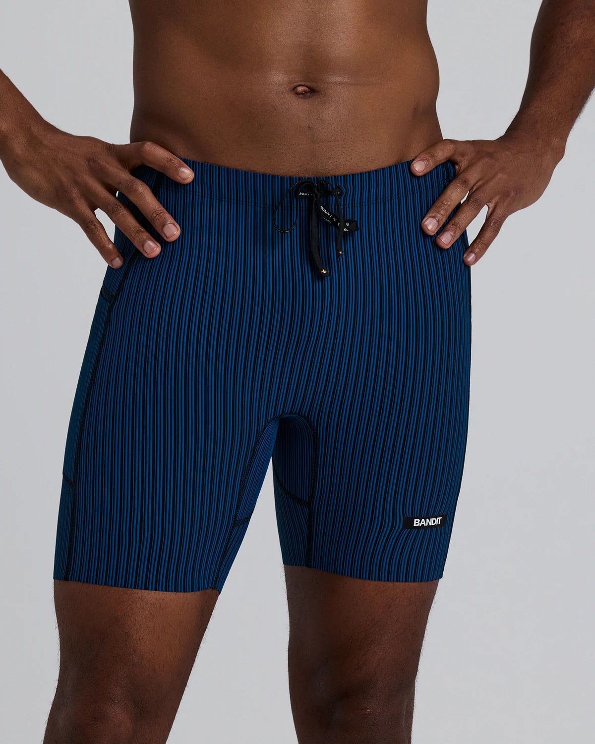 Bandit Running Men's Striped Cadence™ 7 Pocket Lined Quarter Tights - Ink Blue / Black