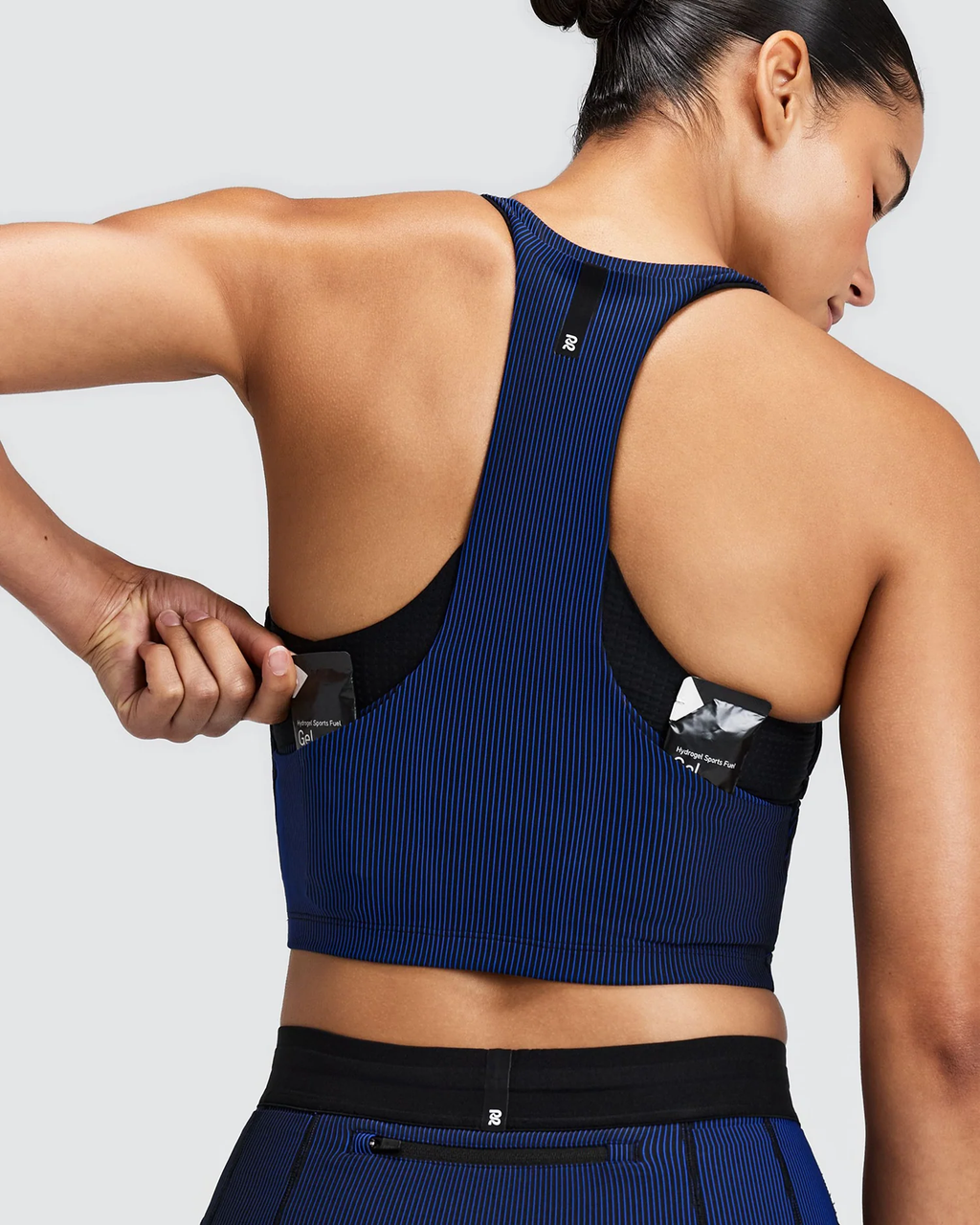 Bandit WOMEN'S STRIPED CADENCE™ ZIP FRONT T BACK RACE CROP - BLACK / BAUHAUS BLUE